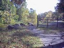 A vehicle barrier with some rocks off around it
