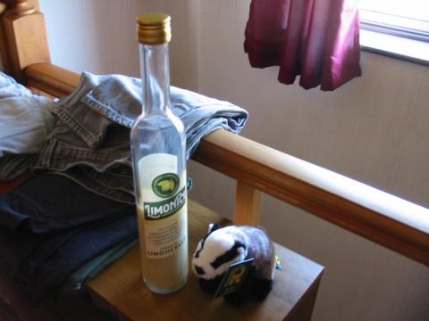 Plushie badger, ft a bottle of limoncello
