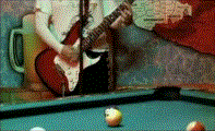Huffer: Kim Deal's guitar arms behind a pool table