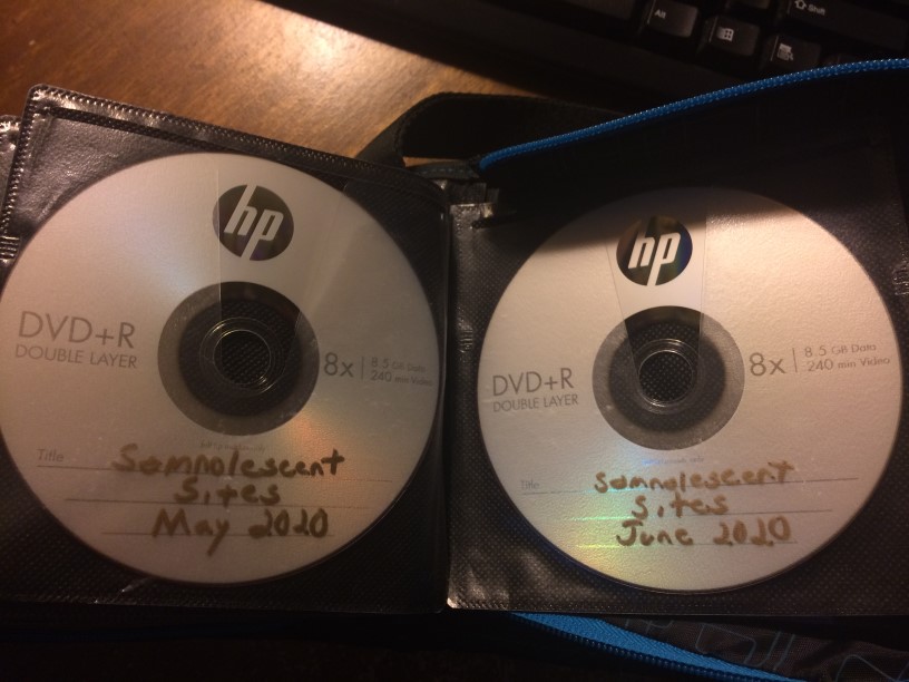 Two of somnolescent.net's backup DVDs